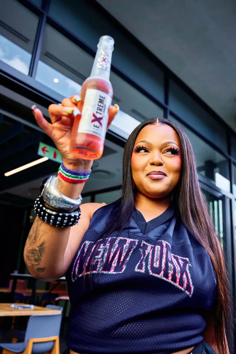DBN Gogo holding an Extreme, label to camera, at the XXIV press call