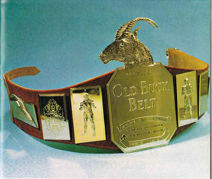 The Old Buck Belt — gold buck's head, engraved boxer plates and the crest